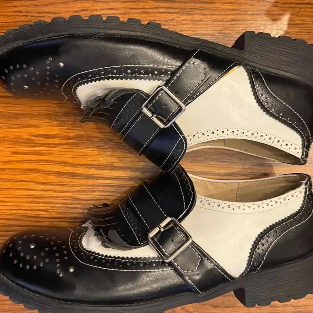 Black and cream leather mary Jane's